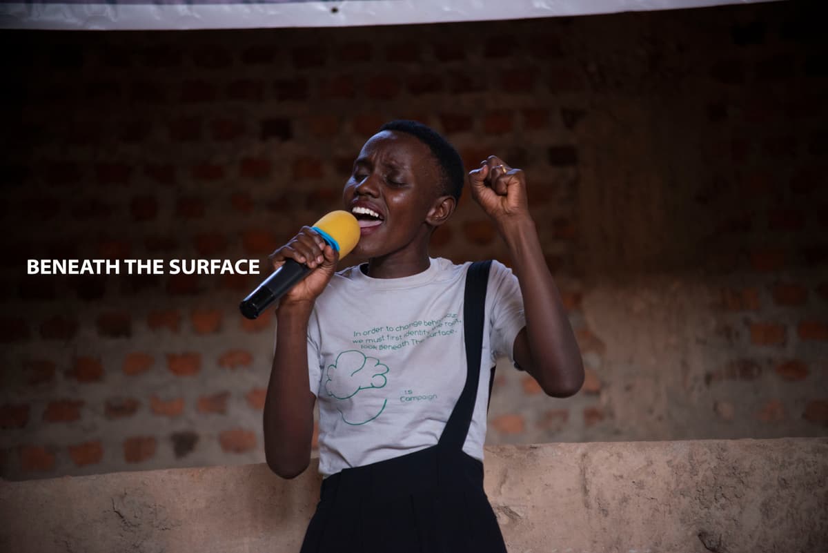 Beneath The Surface - Woman with microphon on stage